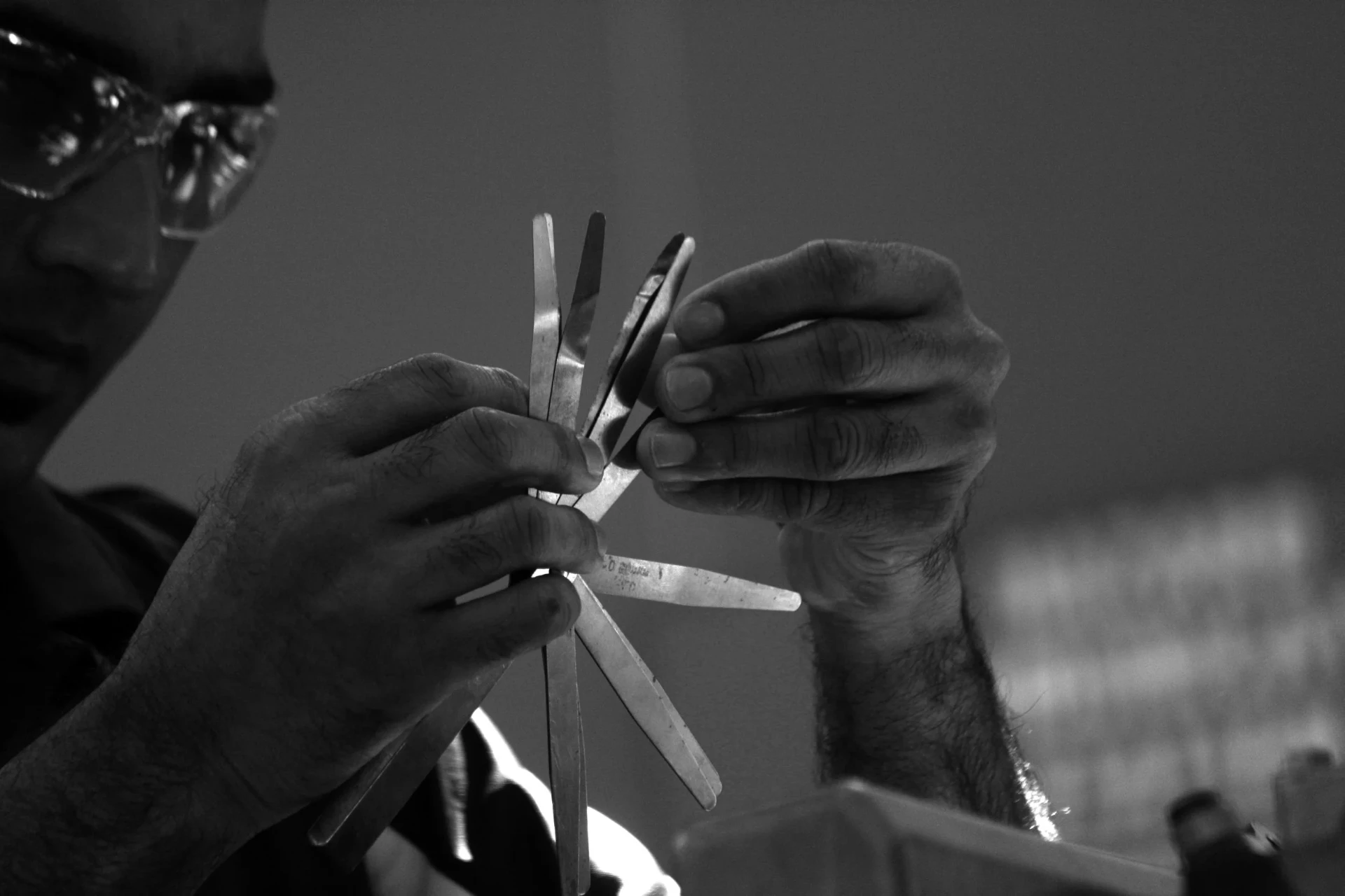 Orefice technician measuring alternator air gaps with feeler gauges